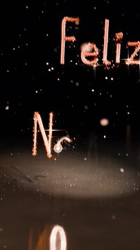 Vertical video: Appearing ember orb tracing letters across dark backdrop, forming Feliz Navidad