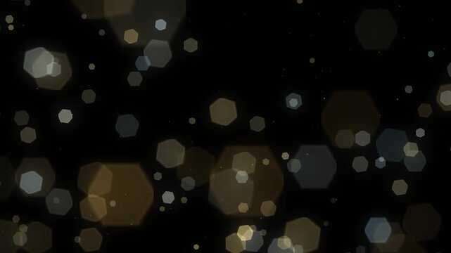 Hexagonal lens ghost flares drifting diagonally across the frame in warm gold and cool blue over a pure black background seamless loop