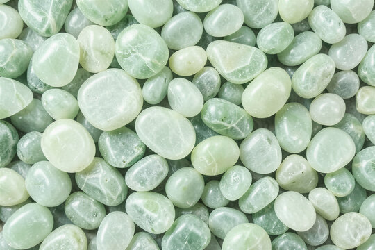 Tumbled Green Jadeite Wellness Pebble Surface Macro Flat Lay Background