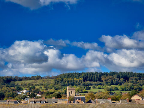 Sidmouth Church Tower and Town Rooftops under Dramatic Blue Sky, East Devon, UK