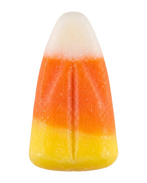 Candy corn standing upright on black