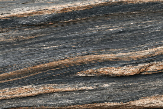 Natural stone texture surface with raw dark gray and brown mineral layers