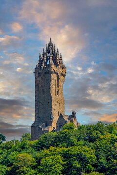 National Wallace Monument tower above forest in Stirling Scotland