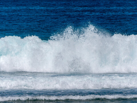 A wave in the ocean at Baie Lazar Beach on Mah&eacute;.