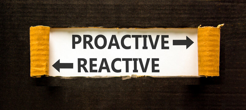 Proactive and reactive symbol. Concept word Proactive Reactive on beautiful white paper. Beautiful black background. Business proactive and reactive concept. Copy space.