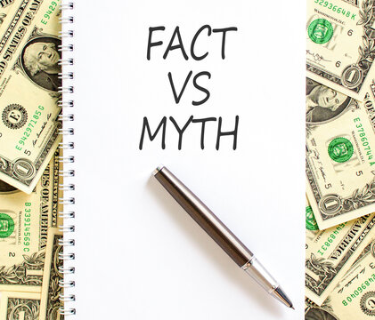 Fact vs versus myth words symbol. Concept words Fact vs Myth on beautiful white note. Beautiful dollar bills background. Business and fact vs versus myth concept. Copy space.
