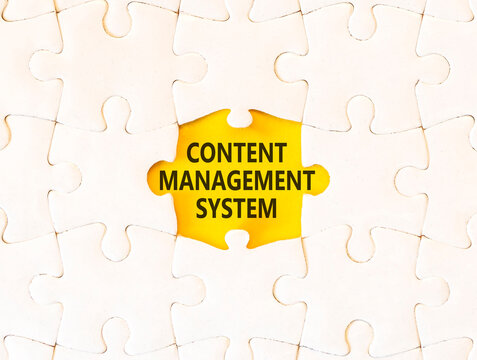 Content management system symbol. Concept words Content management system on beautiful white puzzle. Beautiful yellow background. Business content management system concept. Copy space.