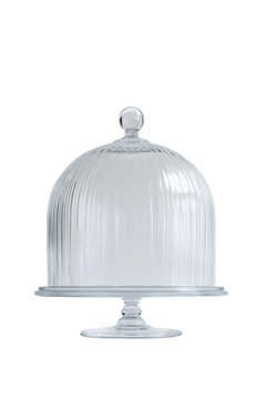 Clear glass cake stand with fluted dome cover isolated on transparent background