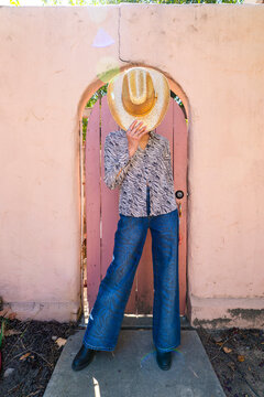 stylish woman posing gold sparkly cowboy hat