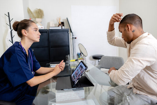Healthcare professional discussing hair loss treatment with patient