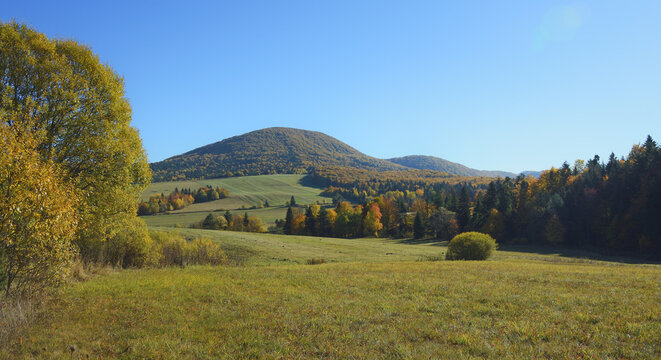 The majestic and gentle ridge of Lackowa Mountain under the endless blue sky