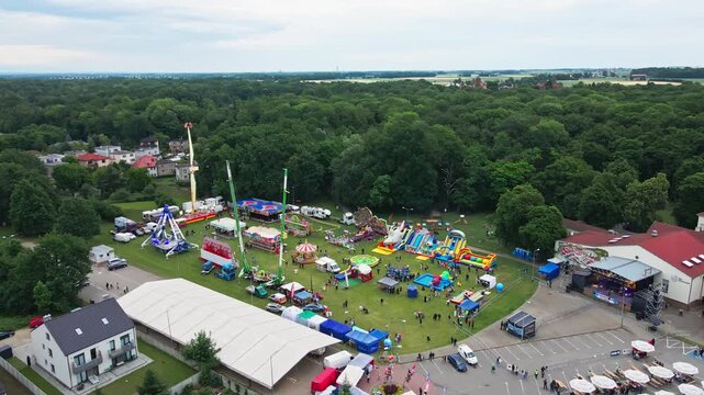Aerial View of Outdoor Funfair with Amusement Rides and Inflatable Slides