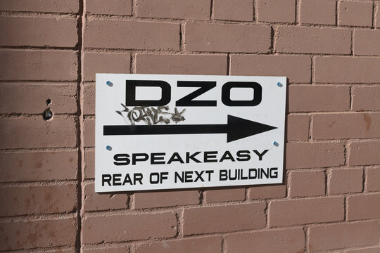 sign on brick wall of Dz&ocirc; Viet Eatery - Bar Đ&ecirc;m at 308 Dundas St W (actual view is of McCaul St), Toronto