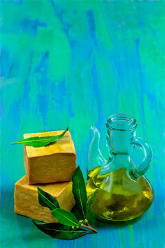 Olive Oil and Wrapped Soap on Blue