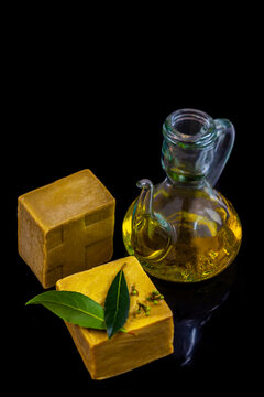 Olive Oil and Cheese on Black Background