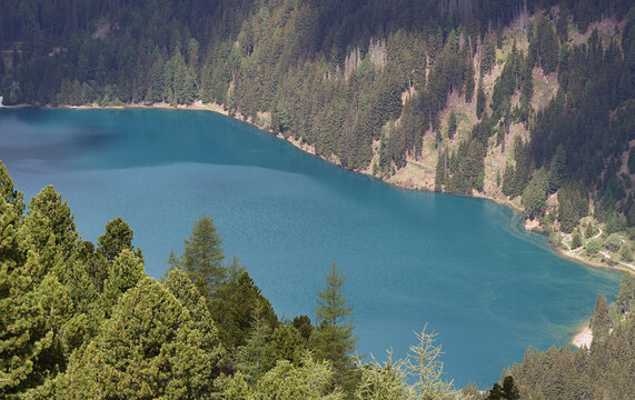 High angle view of turquoise Antholzsee Lago di Anterselva from trail 7A, Rieserferner group, Alto Adige, Italy