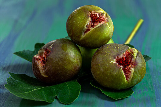 Fresh Figs on Green Wooden Surface