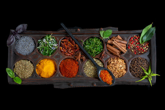 Spices Arranged on Wooden Tray With Spoon