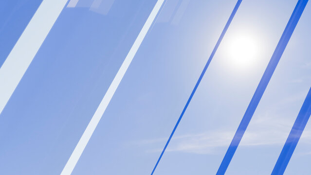 Blue sky with sun shining through transparent stripes
