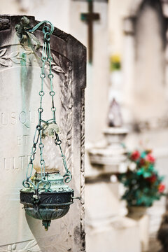 Headstone with decorative lamp cemetery italy