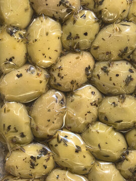 Herb marinated olives sealed in clear vacuum packaging