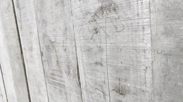 Vertical brown wooden planks texture with weathered grain details