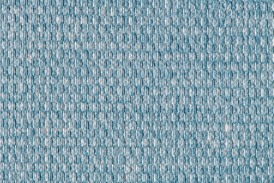 Close up of blue fabric texture with fine textured waffle weave pattern