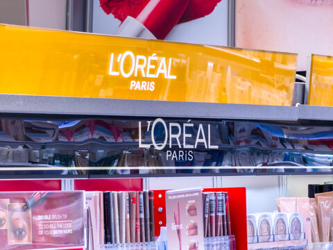 Calgary, AB, Canada. Oct 25, 2026. Medium shot of a L'Or&eacute;al Paris cosmetics display shelf inside a retail store.