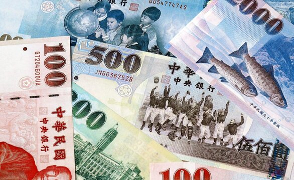Big amount of New Taiwan dollar money banknotes. Taiwan cash bills of TWD currency close up