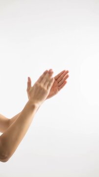 Hands of person clapping on white background