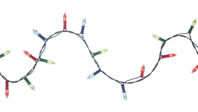 Isolated festive string lights with colorful illuminated bulbs arranged in a playful wavy line