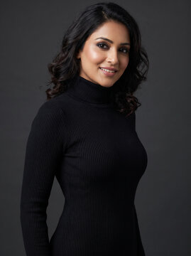 portrait of a woman poised in a black dress