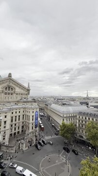 Paris rooftops and opera house seen from above on a cloudy day