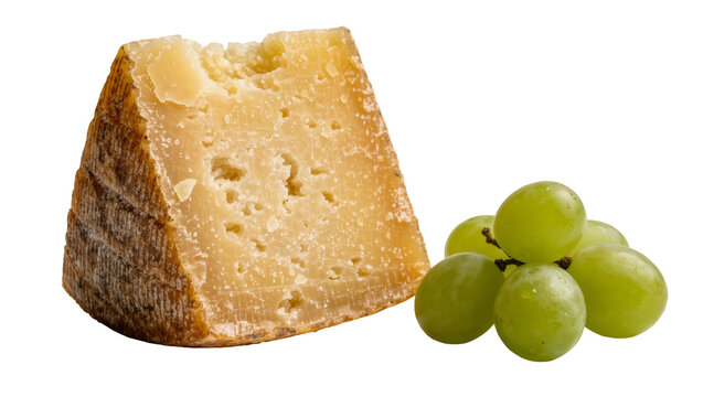 Isolated appetizing wedge of aged hard cheese with textured rind and fresh green grapes