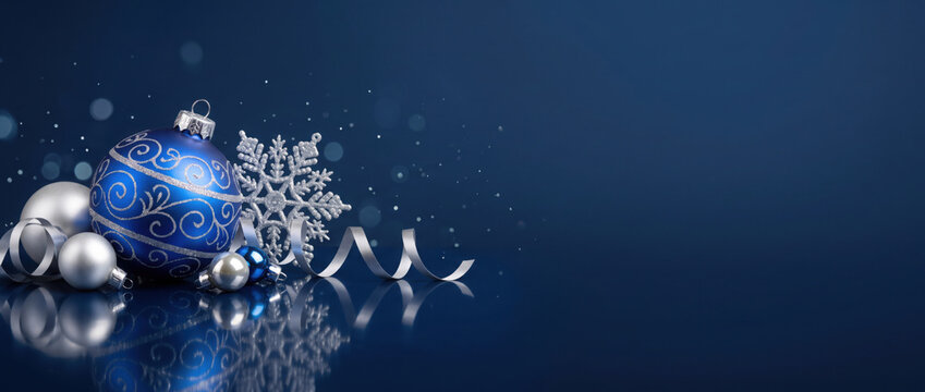 Blue christmas ornaments on blue background. Merry christmas greeting card, banner. Winter holiday xmas theme. Happy New Year.