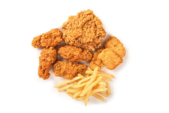 Top View of Crispy fried chicken, nuggets, and french fries isolated on a white background.