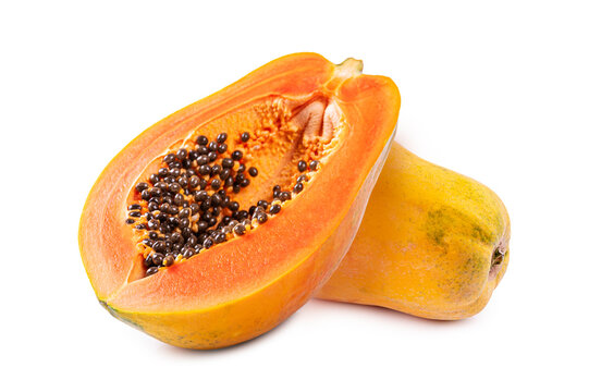 Close up  Orange ripe papaya cut in half, showing black seeds and sweet juicy flesh. Perfect for healthy food and tropical fruit concepts on white background.