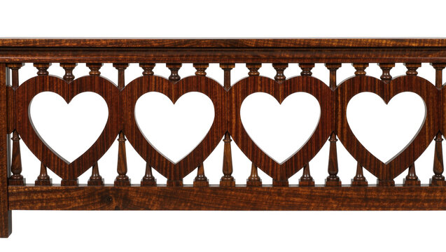 Isolated dark wooden railing with heart shape cutouts, ornate handcrafted furniture detail