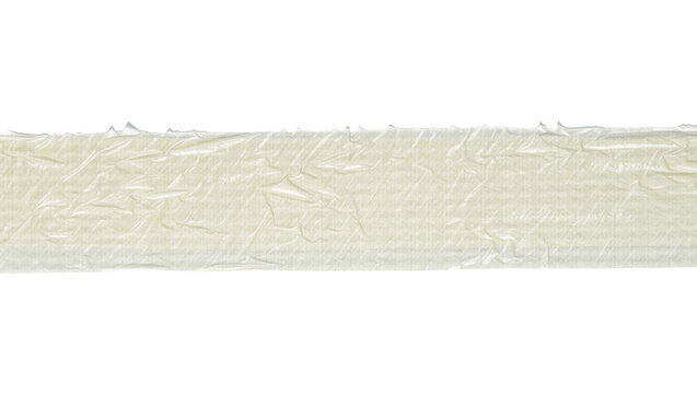 Isolated crumpled textured translucent adhesive tape, light beige wrinkled plastic material strip