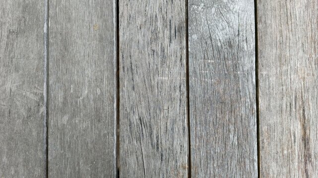 Vintage-style old wood texture background with a cracked effect. Close-up view of an old wood texture background.
