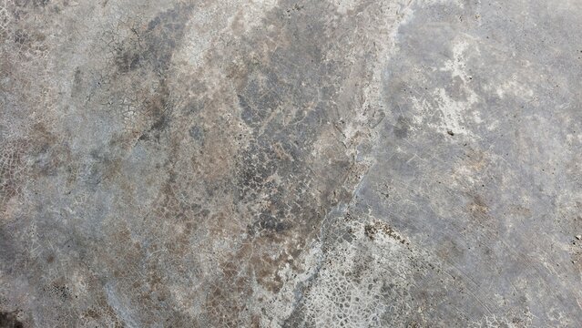 Grungy cement texture background. Spots of white paint on a gray concrete background, texture, photo. old cement