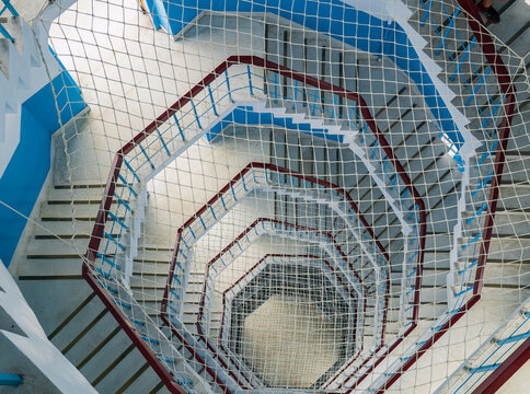Geometric spiral staircase with safety net viewed from above