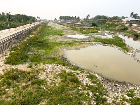 Polluted Riverbed and Embankment in Rural Area