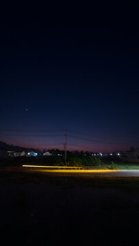 Night Landscape With Light Trail on Road