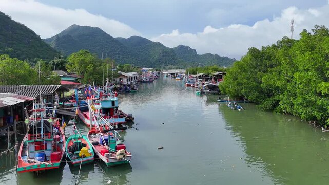 26,Otc,2026,Pranburi Thailand,Aerial video shows fishing villages along rivers and coastlines in various provinces of southern Thailand, where villagers use motorboats of different sizes to catch fish