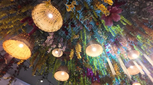 Wicker Lanterns and Hanging Floral Ceiling Installation with Warm Lighting