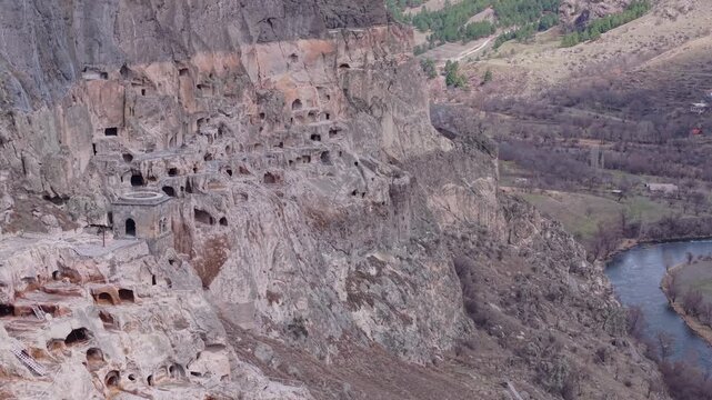 Aerial footage captures Vardzia Cave Town carved into towering cliffs above the Mtkvari River, showcasing one of Georgia&rsquo;s most remarkable ancient civilizations.