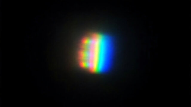 Colorful abstract light sphere with rainbow glow against dark background illustration
