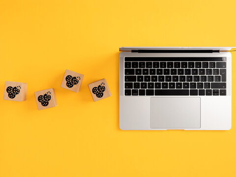 Browser cookies privacy concept with laptop and wooden blocks