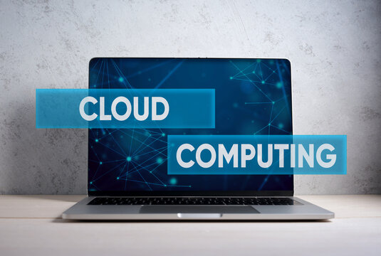 Laptop displaying cloud computing concept and network connections